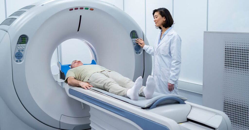 A woman lies on an MRI machine, preparing for a medical imaging procedure.