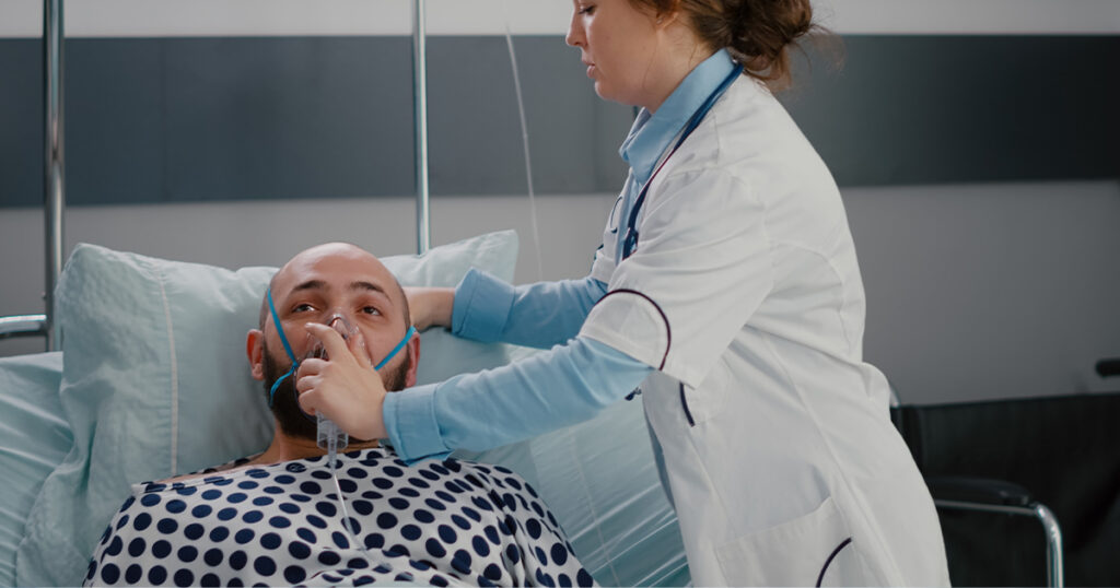 Medical professional treating a patient for severe shortness of breath, a potential emergency complication of GERD.