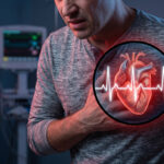 A distressed man clutching his chest with an overlaid graphic of a glowing red anatomical heart and a white EKG heartbeat line.