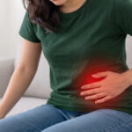 Woman experiencing lower left abdominal pain